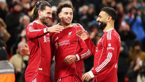 Dominik Szoboszlai, Curtis Jones and Mohamed Salah celebrate during Liverpool's win over Brighton