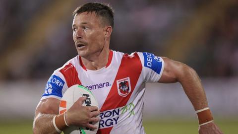 Damien Cook carrying the ball for St George Illawarra Dragons