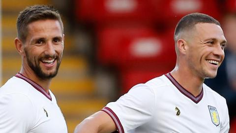 Conor Hourihane and Wales defender James Chester in action for Aston Villa