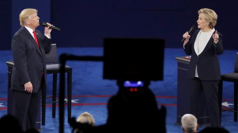 Republican U.S. presidential nominee Donald Trump and Democratic U.S. presidential nominee Hillary Clinton speak during their presidential town hall debate at Washington University in St. Louis, Missouri, U.S., October 9, 2016.