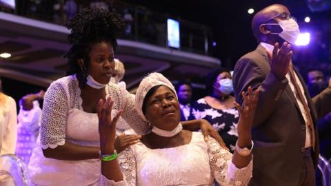 A woman cries at TB Joshua's burial