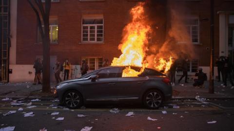 A car set alight in Paris