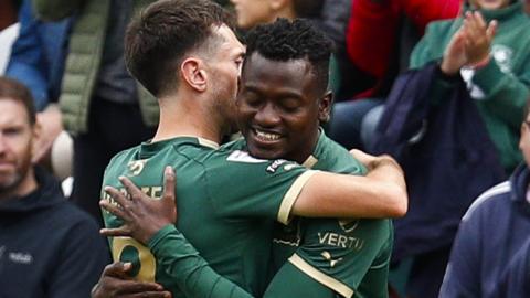 Ryan Hardie and Mustapha Bundu embrace