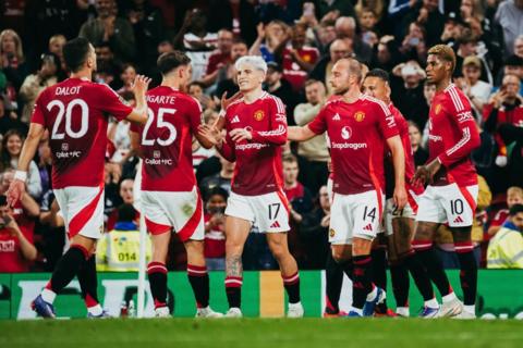 Manchester United players celebrate a goal