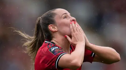 Ella Toone blows a kiss after scoring a goal