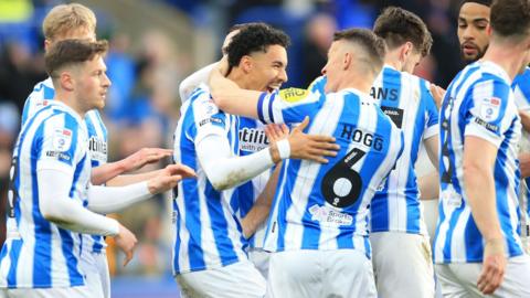 Ruben Roosken celebrates scoring Huddersfield fifth goal against Crawley Town with team mates.