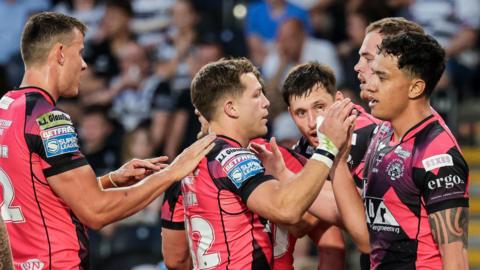Castleford Tigers celebrate a try against Hull FC