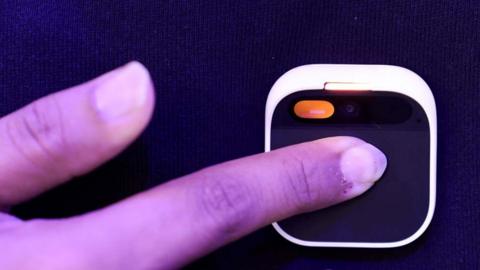 An employee demonstrates a wearable Humane Inc. AI pin on the opening day of the Mobile World Congress at the Fira de Barcelona venue in Barcelona, Spain, on 26 February 2024