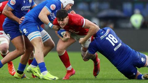 Eddie James carries the ball for Wales against Italy in Rome