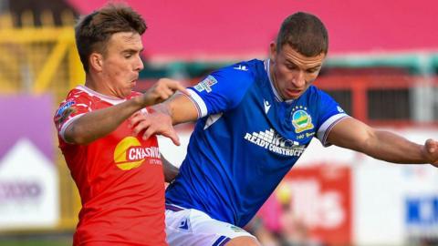 Shelbourne's James Norris in action against Ethan McGee of Linfield