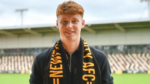 Newport goalkeeper Jacob Carney smiles