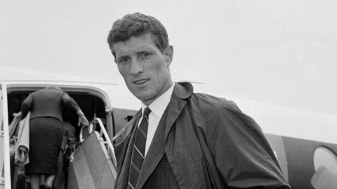 Willie Stevenson boards a plane in 1962