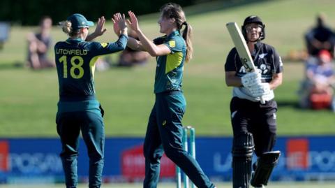 Australia's Phoebe Litchfield and Annabel Sutherland celebrate a wicket against New Zealand