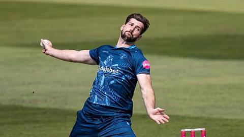 Derbyshire's Ben Aitchison bowling.