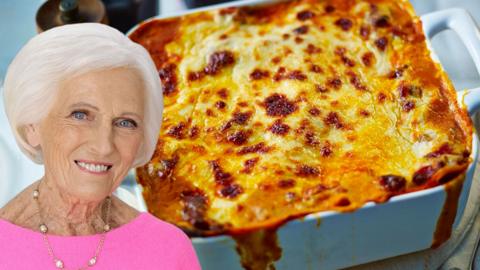 A photo of Mary Berry, edited on top of a tray of lasagne.
