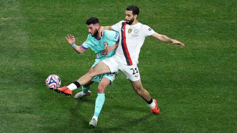 Rayan Ait-Nouri challenges the ball