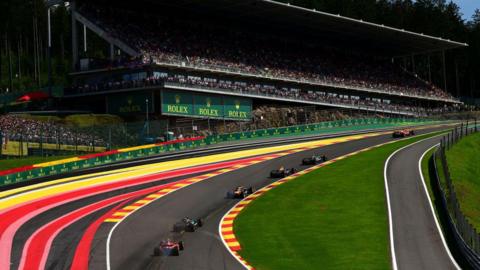 Charles Leclerc leads the field up Eau Rouge at the Spa-Francorchamps circuit