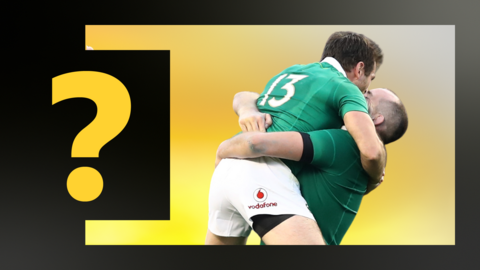 Two Ireland players celebrate defeating New Zealand