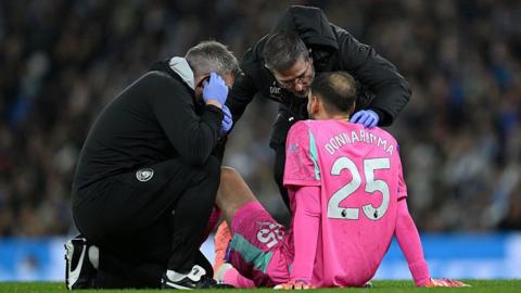 Gianluigi Donnarumma of Manchester City receives medical treatment during the Premier League match against Leeds United