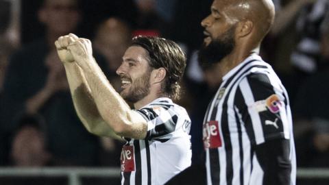 Notts County players celebrate a goal