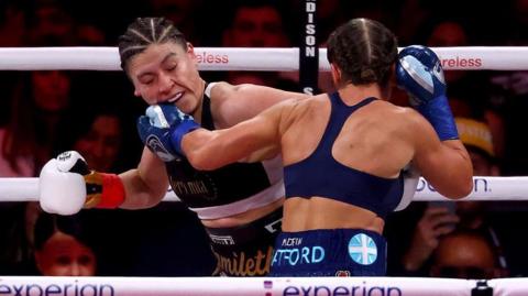 Ellie Scotney lands a punch on the chin of Yamileth Mercado