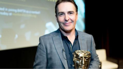 Nolan North accepts his BAFTA Special Award