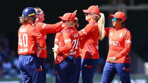 England players celebrate a wicket