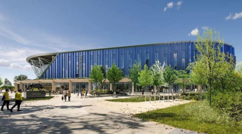 Computer mock-up of exterior of new stadium. It has a glass façade around it, and is surrounded by pathways and trees.