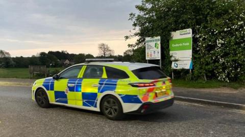 Police car at Gosforth Fields, in Bubnell Road, Dronfield, Derbyshire.