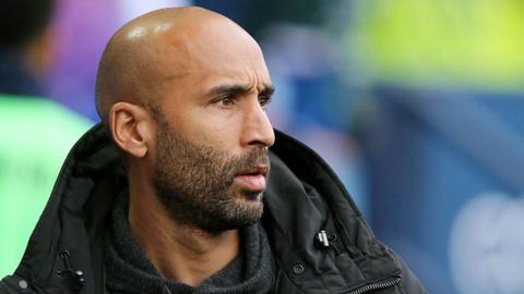 Lee Grant watches a game from the touchline