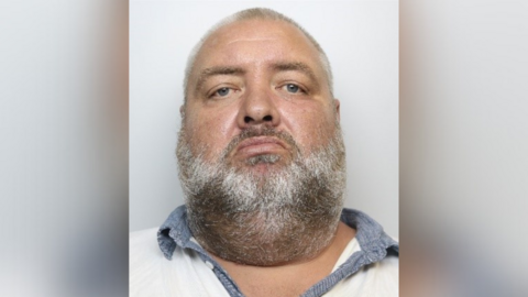 William Lee mugshot. He is a large chap with short grey hair and a short grey beard.