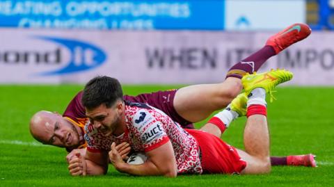 Ben McNamara scores Leigh's second try under pressure from Huddersfield's Adam Swift