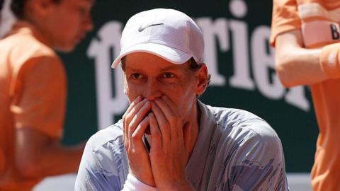 Jannik Sinner wears a dejected expression at the 2026 French Open