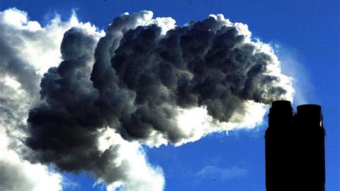 Smoke coming from the chimney of a factory