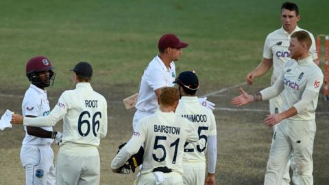 Players shake hands at the close