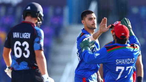 Naveen celebrates wicket
