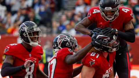 Atlanta Falcons wide receiver Tajae Sharpe congratulates tight end Hayden Hurst after he scores a touchdown against the New York Jets