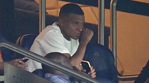 Kylian Mbappe watches Saturday's game from the stands