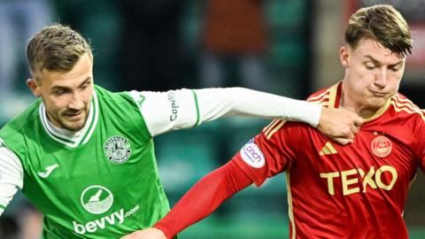 Hibernian's Dylan Vente and Aberdeen's James McGarry in action