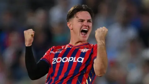 Manchester Super Giants bowler Sonny Baker celebrates taking a wicket