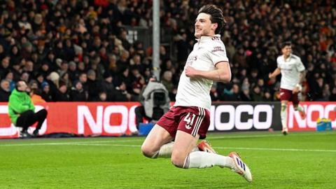 Declan Rice slides on his knees