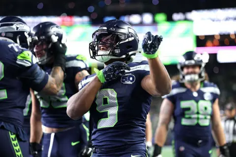 Ken Walker celebrates