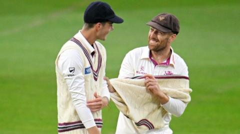 Jack Leach shares a few tricks of the trade with 18-year-old Archie Vaughan