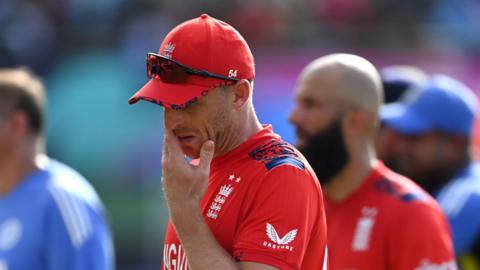 England captain Jos Buttler looks dejected as he walks off the field