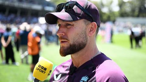 Brendon McCullum speaking into a BBC Sport microphone
