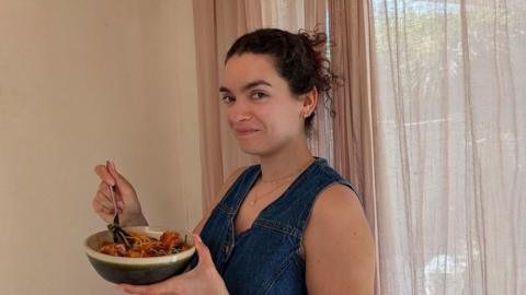 Woman eating spaghetti