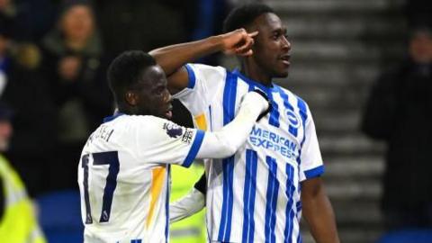 Danny Welbeck celebrates with Yankuba Minteh after scoring for Brighton against Bournemouth