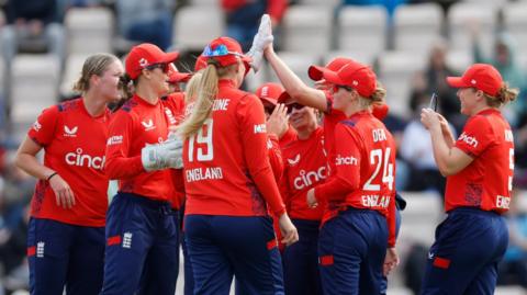 England celebrate the run out of Georgia Plimmer