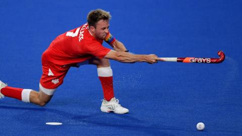 England's Zach Wallace hits the ball