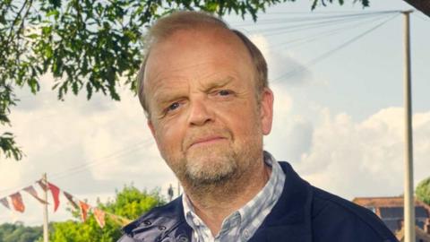 Toby Jones as Alan Bates